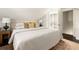 Comfortable bedroom features a cozy bed, elegant lighting, and neutral decor at 731 Hobart Se Ave, Atlanta, GA 30312