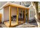 Inviting front porch with wood flooring, comfortable seating, and stylish lighting at 731 Hobart Se Ave, Atlanta, GA 30312