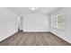 The bedroom features white walls, hardwood flooring, and natural light from the window at 3532 Dial Dr, Stone Mountain, GA 30083