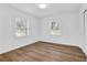 Bright bedroom with two windows and hardwood flooring for a warm and inviting space at 3532 Dial Dr, Stone Mountain, GA 30083