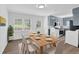 Bright dining area with wooden table, white chairs, and a view of the backyard at 3532 Dial Dr, Stone Mountain, GA 30083
