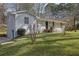 Charming brick home with well-maintained lawn and landscaping offers classic curb appeal at 3532 Dial Dr, Stone Mountain, GA 30083