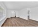 Clean and bright living room with hardwood floors and a view of an adjoining room at 3532 Dial Dr, Stone Mountain, GA 30083