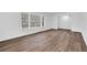 Spacious living room featuring hardwood floors and a large window with abundant natural light at 3532 Dial Dr, Stone Mountain, GA 30083