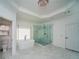 Bright bathroom featuring marble floors, glass shower, soaker tub and a stunning chandelier at 6195 Mountainwell Dr, Roswell, GA 30075