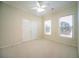 Bright bedroom featuring a ceiling fan, neutral walls and carpet at 6195 Mountainwell Dr, Roswell, GA 30075