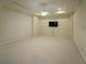 Bonus room featuring a flat screen television and carpeted floor at 6195 Mountainwell Dr, Roswell, GA 30075
