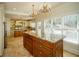 Spacious kitchen with granite countertops, an island, and plenty of natural light at 6195 Mountainwell Dr, Roswell, GA 30075