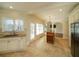 Open eat-in kitchen with stainless steel appliances, granite countertops, and a center island at 6195 Mountainwell Dr, Roswell, GA 30075