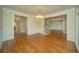 Bright living room with hardwood floors, chandelier, and ample natural light at 6195 Mountainwell Dr, Roswell, GA 30075