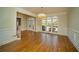 Elegant living room with hardwood floors, large windows, and classic trim at 6195 Mountainwell Dr, Roswell, GA 30075