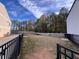 Large, private backyard with a fence, a grassy area, and mature trees at 671 Stickley Oak Way, Woodstock, GA 30189