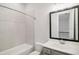 Bright bathroom featuring a bathtub, shower, and a vanity with a large mirror at 671 Stickley Oak Way, Woodstock, GA 30189