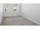 Empty carpeted bedroom with windows offering natural light at 671 Stickley Oak Way, Woodstock, GA 30189