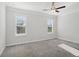 Bright bedroom featuring neutral carpet, a ceiling fan, and natural lighting at 671 Stickley Oak Way, Woodstock, GA 30189
