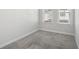 Bright bedroom with two windows, neutral carpet and trim at 671 Stickley Oak Way, Woodstock, GA 30189