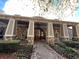 Clubhouse exterior featuring stone columns and a brick walkway at 671 Stickley Oak Way, Woodstock, GA 30189