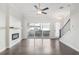 Living room with a ceiling fan, fireplace, and sliding glass doors leading to the outdoor patio at 671 Stickley Oak Way, Woodstock, GA 30189