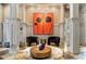 Community lounge area with modern art and decorative lighting, and comfortable seating at 671 Stickley Oak Way, Woodstock, GA 30189