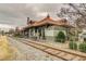 The Freighthouse Restaurant features outdoor dining in a vintage setting, located near railroad tracks at 671 Stickley Oak Way, Woodstock, GA 30189