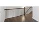 Wood staircase with iron railing and wood floors at 671 Stickley Oak Way, Woodstock, GA 30189