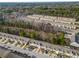 An aerial view of townhomes showcases the community layout, greenery, and street parking at 1769 Old Dogwood, Jonesboro, GA 30238