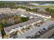 Aerial view of townhouse community near a highway, pond, and treeline at 1769 Old Dogwood, Jonesboro, GA 30238