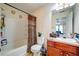 This bathroom features a shower-tub combo, toilet and vanity sink at 1769 Old Dogwood, Jonesboro, GA 30238