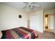 Bedroom with carpet, ceiling fan, closet, and an open doorway at 1769 Old Dogwood, Jonesboro, GA 30238