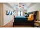 A spacious bedroom featuring a tray ceiling, ceiling fan, and ample natural light at 1769 Old Dogwood, Jonesboro, GA 30238