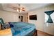 Bedroom with a ceiling fan, mounted television, and access to the balcony at 1769 Old Dogwood, Jonesboro, GA 30238