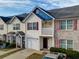 Inviting townhouse featuring an attached garage, a balcony, and colorful accents at 1769 Old Dogwood, Jonesboro, GA 30238