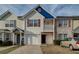 Charming townhome featuring a garage, quaint balcony, and lovely curb appeal at 1769 Old Dogwood, Jonesboro, GA 30238