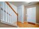 Welcoming foyer with staircase, white railing and neutral walls at 1769 Old Dogwood, Jonesboro, GA 30238
