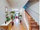 Well-lit hallway showcases a staircase and leads to living spaces at 1769 Old Dogwood, Jonesboro, GA 30238
