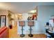 Inviting kitchen bar area featuring two stools and views into the kitchen area at 1769 Old Dogwood, Jonesboro, GA 30238