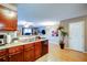 Kitchen area featuring a breakfast bar overlooking the living area and a ceiling fan at 1769 Old Dogwood, Jonesboro, GA 30238
