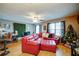 Comfortable living room features a large sofa, adjacent dining area and bright windows at 1769 Old Dogwood, Jonesboro, GA 30238