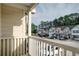 Enjoy the fresh air from the deck, with serene views of neighboring townhomes and evergreens at 1769 Old Dogwood, Jonesboro, GA 30238