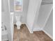 Bright bathroom featuring tile floors, toilet, tub, and shower at 2473 Chauncey Sw Ln, Marietta, GA 30064