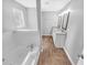 Updated bathroom features a double sink vanity with granite countertops and a tiled shower/tub at 2473 Chauncey Sw Ln, Marietta, GA 30064