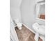 Compact bathroom featuring a toilet and pedestal sink, ideal for a small space or powder room at 2473 Chauncey Sw Ln, Marietta, GA 30064