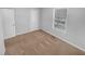 Bright bedroom with neutral carpet, window, and closet at 2473 Chauncey Sw Ln, Marietta, GA 30064
