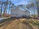 Charming two-story home with gray siding, a bay window and mature trees at 2473 Chauncey Sw Ln, Marietta, GA 30064
