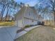 View of the home's exterior highlighting the garage, siding, and landscaped front yard at 2473 Chauncey Sw Ln, Marietta, GA 30064