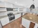 Modern kitchen featuring granite countertops, stainless steel appliances, and ample cabinet space at 2473 Chauncey Sw Ln, Marietta, GA 30064