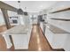 Modern kitchen with white cabinetry, granite countertops, stainless steel appliances and eat-in island at 2473 Chauncey Sw Ln, Marietta, GA 30064