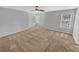 Spacious main bedroom featuring neutral walls, carpeting and natural light from multiple windows at 2473 Chauncey Sw Ln, Marietta, GA 30064