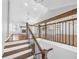 Bright entryway showcasing staircase with wooden railings and hardwood floors leading to an open living space at 2473 Chauncey Sw Ln, Marietta, GA 30064