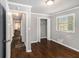 Bedroom with hardwood floors, closet, window with blinds, and neutral paint color at 2695 Terratim Ln, Decatur, GA 30034